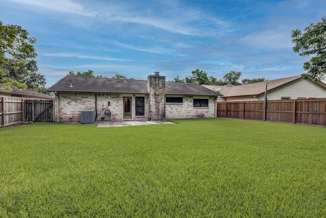 1041 Crossing Rd, Angleton, TX 77515 - back of house with a fenced backyard, a chimney, a patio area, and brick siding