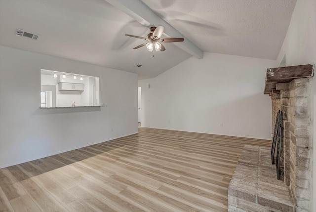 1041 Crossing Rd, Angleton, TX 77515 - unfurnished living room with a ceiling fan, light wood-style floors, and a fireplace with raised hearth