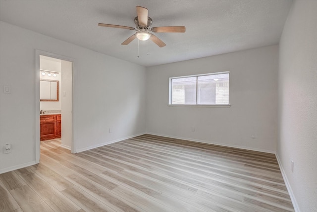 1041 Crossing Rd, Angleton, TX 77515 - empty room with light wood-style flooring and a ceiling fan