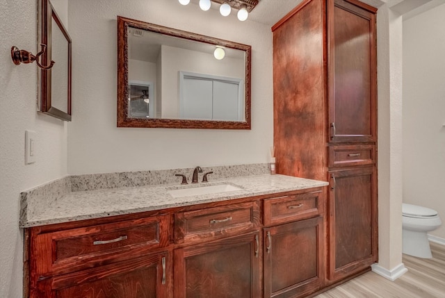 1041 Crossing Rd, Angleton, TX 77515 - bathroom with vanity and wood finished floors