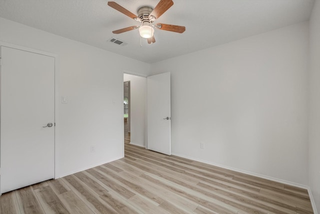 1041 Crossing Rd, Angleton, TX 77515 - unfurnished bedroom featuring light wood-style flooring and ceiling fan