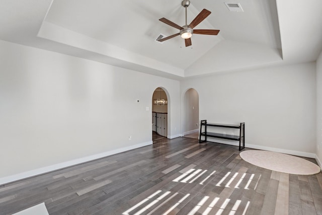 5807 Yango Terrace Ln, Sugar Land, TX 77479 - spare room with arched walkways, a ceiling fan, wood finished floors, lofted ceiling, and baseboards