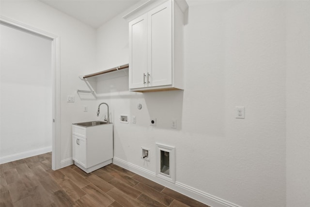 25306 Hollowgate Park Ln, Tomball, TX 77375 - washroom with electric dryer hookup, gas dryer hookup, hookup for a washing machine, and dark wood-style floors