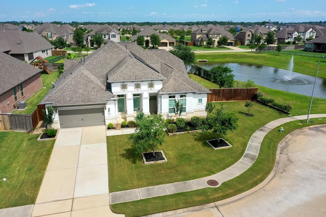 25306 Hollowgate Park Ln, Tomball, TX 77375 - view of front of property featuring a residential view, an attached garage, a shingled roof, and concrete driveway