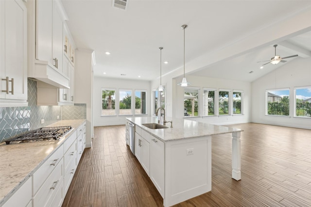 25306 Hollowgate Park Ln, Tomball, TX 77375 - kitchen with a sink, open floor plan, dark wood-type flooring, backsplash, and stainless steel appliances