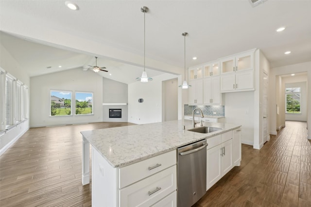 25306 Hollowgate Park Ln, Tomball, TX 77375 - kitchen featuring stainless steel dishwasher, a sink, ceiling fan, healthy amount of natural light, and recessed lighting