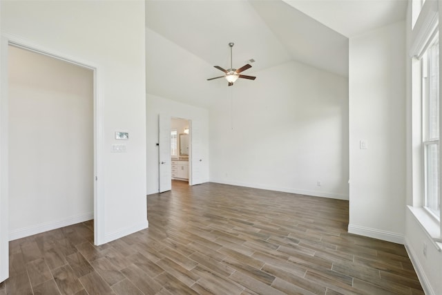 25306 Hollowgate Park Ln, Tomball, TX 77375 - unfurnished room featuring a ceiling fan, wood finished floors, vaulted ceiling, and baseboards