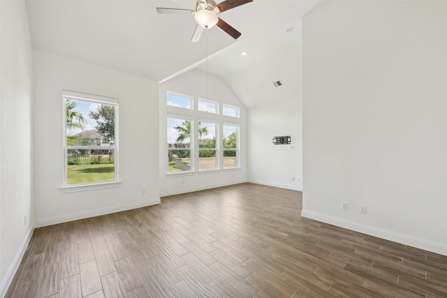 25306 Hollowgate Park Ln, Tomball, TX 77375 - unfurnished room with a ceiling fan, wood finished floors, baseboards, and high vaulted ceiling