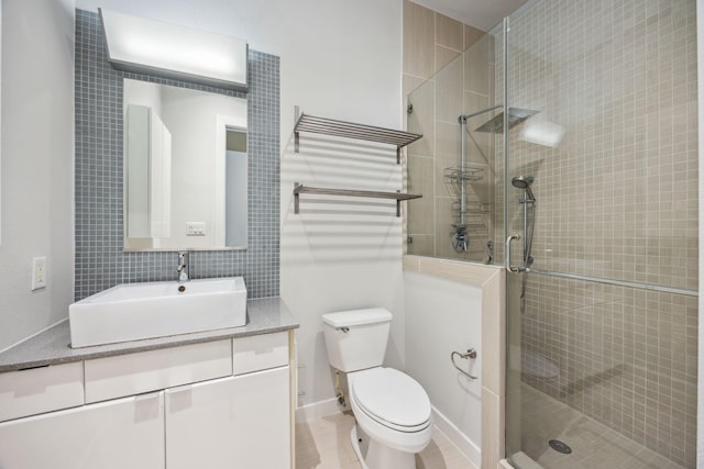 207 Pierce St Unit 205, Houston, TX 77002 - full bath featuring vanity, toilet, a stall shower, and tile walls