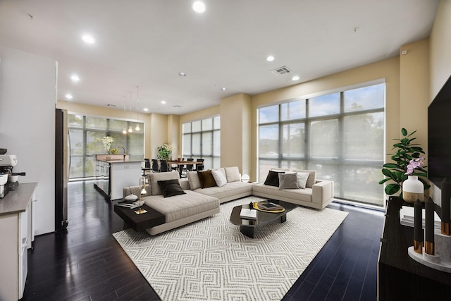 207 Pierce St Unit 205, Houston, TX 77002 - living area featuring dark wood-style flooring, plenty of natural light, and recessed lighting