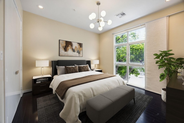 207 Pierce St Unit 205, Houston, TX 77002 - bedroom with a chandelier, dark wood finished floors, recessed lighting, and baseboards
