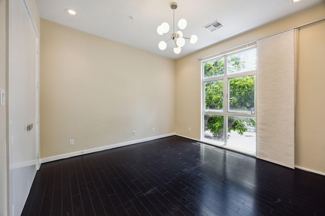 207 Pierce St Unit 205, Houston, TX 77002 - empty room with a chandelier, wood finished floors, baseboards, and recessed lighting
