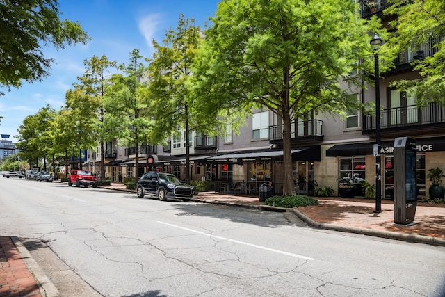 207 Pierce St Unit 205, Houston, TX 77002 - view of asphalt road with street lights, sidewalks, and curbs