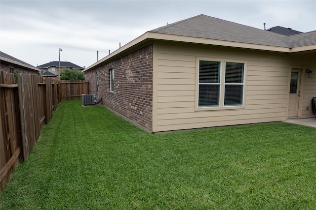 3017 Cambridge Meadows Ln, Dickinson, TX 77539 - view of side of property with brick siding, cooling unit, and roof with shingles