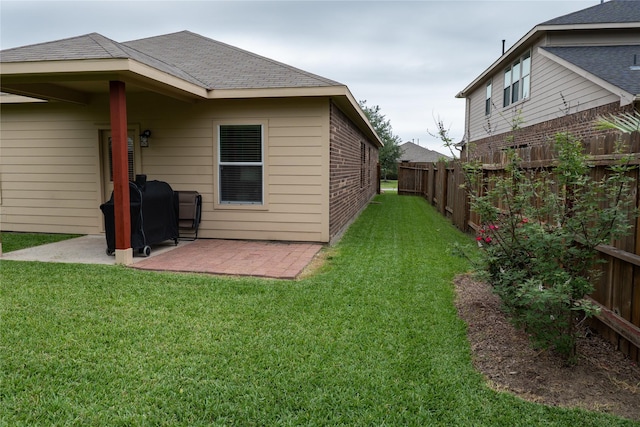 3017 Cambridge Meadows Ln, Dickinson, TX 77539 - view of side of property with a patio area, a shingled roof, and brick siding