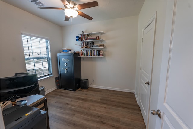 3017 Cambridge Meadows Ln, Dickinson, TX 77539 - office area with wood finished floors, ceiling fan, and baseboards