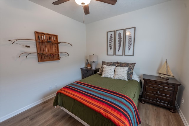 3017 Cambridge Meadows Ln, Dickinson, TX 77539 - bedroom featuring wood finished floors, baseboards, and a ceiling fan
