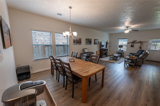 3017 Cambridge Meadows Ln, Dickinson, TX 77539 - dining room with wood finished floors, a textured ceiling, a chandelier, a ceiling fan, and baseboards