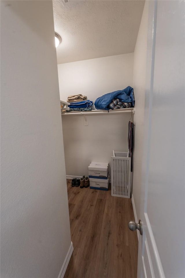 3017 Cambridge Meadows Ln, Dickinson, TX 77539 - walk in closet with wood finished floors