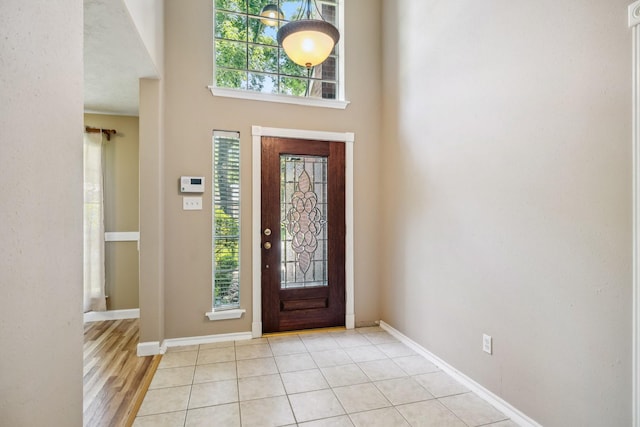 19 Almond Branch Pl, The Woodlands, TX 77382 - entryway featuring healthy amount of natural light, baseboards, and a towering ceiling