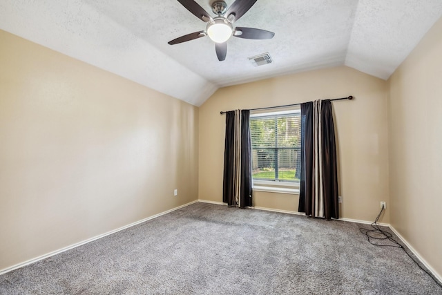 19 Almond Branch Pl, The Woodlands, TX 77382 - carpeted empty room featuring vaulted ceiling, a textured ceiling, a ceiling fan, and baseboards