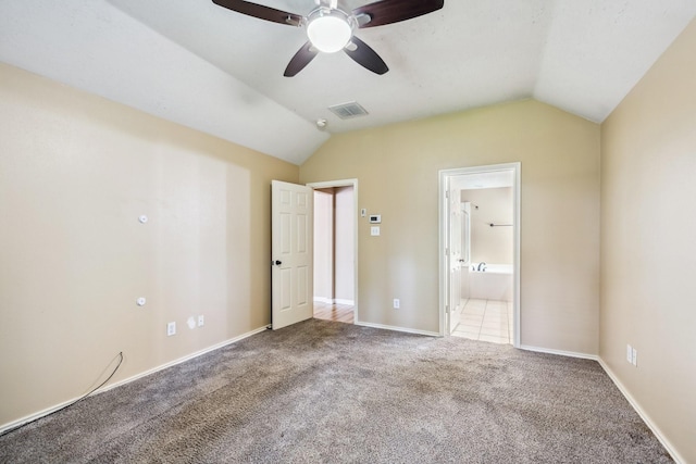 19 Almond Branch Pl, The Woodlands, TX 77382 - unfurnished bedroom with lofted ceiling, carpet, baseboards, connected bathroom, and ceiling fan