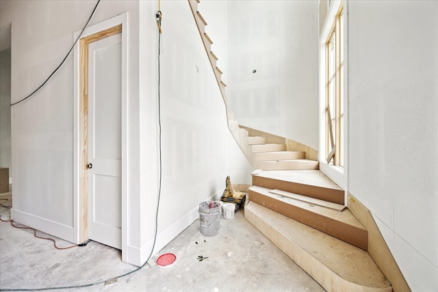 830 Azalea St, Houston, TX 77018 - staircase featuring concrete floors and baseboards