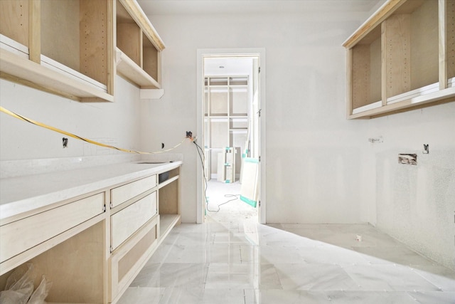 830 Azalea St, Houston, TX 77018 - laundry room with light marble finish floors