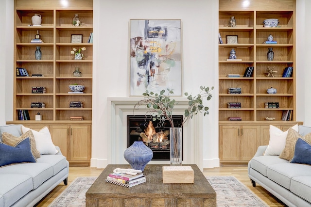 830 Azalea St, Houston, TX 77018 - living area with light wood-type flooring and a warm lit fireplace