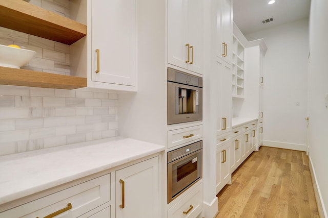 830 Azalea St, Houston, TX 77018 - kitchen featuring open shelves, white cabinets, light wood-type flooring, backsplash, and recessed lighting