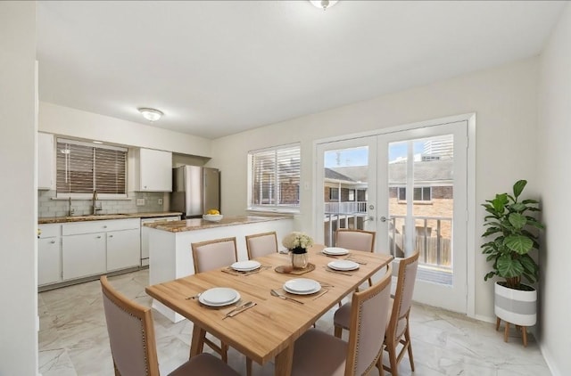4040 San Felipe St Unit 246, Houston, TX 77027 - dining area featuring light marble finish flooring and french doors