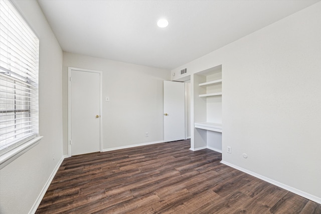 4040 San Felipe St Unit 246, Houston, TX 77027 - unfurnished bedroom with baseboards, dark wood-type flooring, and recessed lighting
