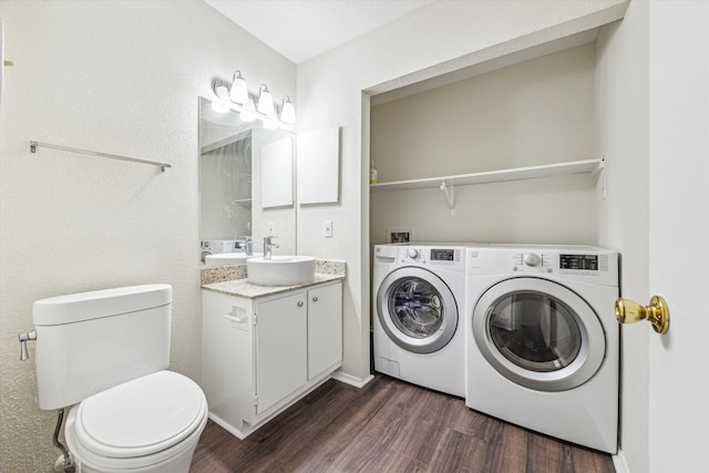 4040 San Felipe St Unit 246, Houston, TX 77027 - laundry area featuring washer and dryer and dark wood-style floors
