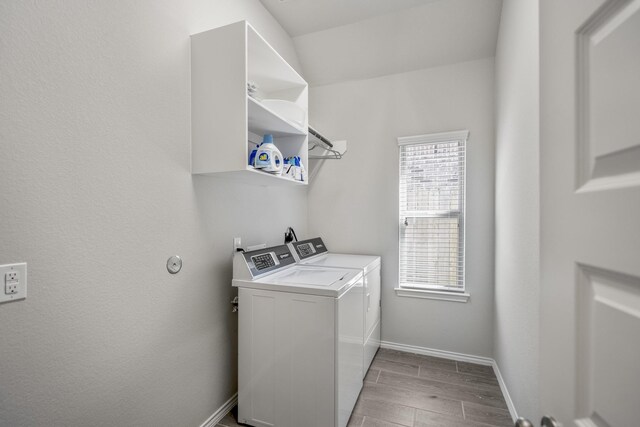 229 N Bearkat Ct, Montgomery, TX 77316 - washroom featuring independent washer and dryer, wood tiled floors, and baseboards