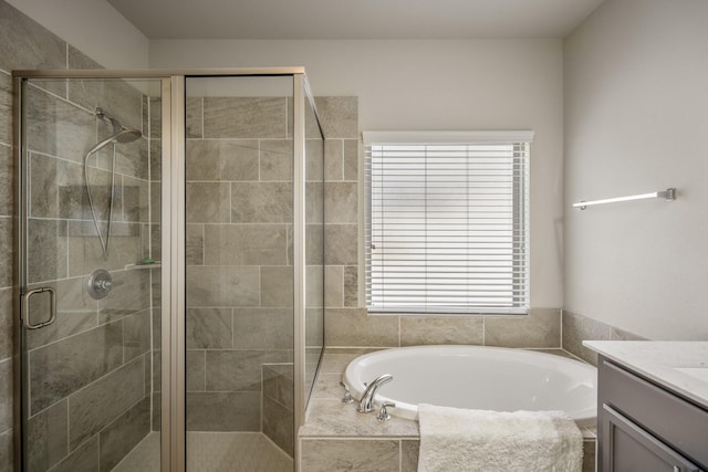 229 N Bearkat Ct, Montgomery, TX 77316 - bathroom with vanity, a garden tub, healthy amount of natural light, and a stall shower
