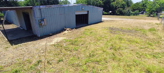 610 New York St, Navasota, TX 77868 - view of yard with a detached garage and an outbuilding