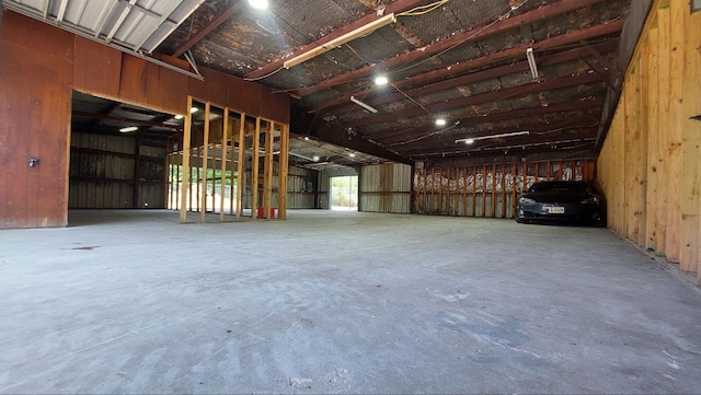 610 New York St, Navasota, TX 77868 - miscellaneous room featuring unfinished concrete flooring and a garage