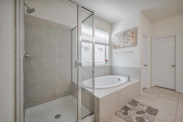 11202 Bluewater Lagoon Cir, Cypress, TX 77433 - full bathroom with a shower stall, a garden tub, and tile patterned flooring