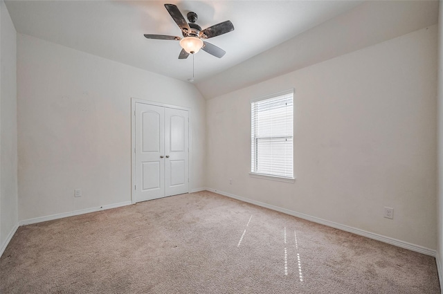 11202 Bluewater Lagoon Cir, Cypress, TX 77433 - unfurnished bedroom with carpet floors, baseboards, a closet, and vaulted ceiling