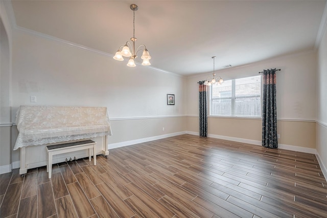 11202 Bluewater Lagoon Cir, Cypress, TX 77433 - empty room with a chandelier, crown molding, wood finished floors, and baseboards