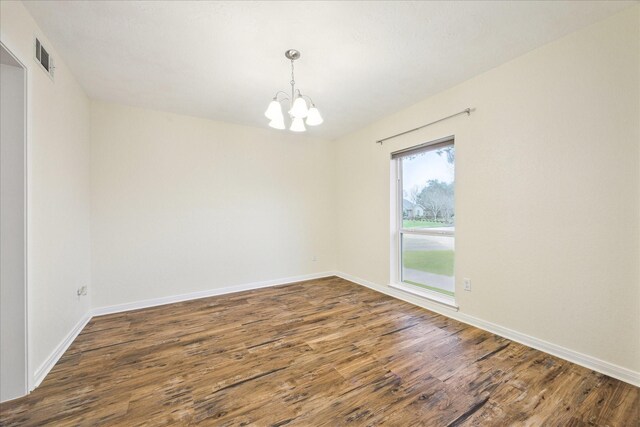 507 Williamsport St, League City, TX 77573 - unfurnished room featuring a chandelier, wood finished floors, and baseboards