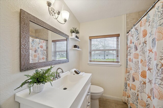 507 Williamsport St, League City, TX 77573 - bathroom with vanity, tile patterned floors, toilet, a textured wall, and a shower with shower curtain