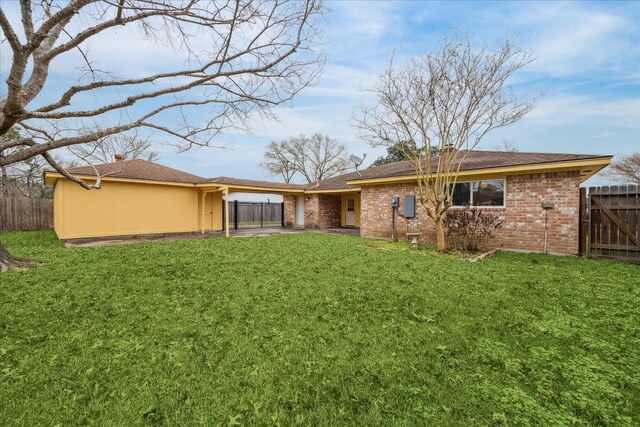 507 Williamsport St, League City, TX 77573 - back of house with brick siding and a gate