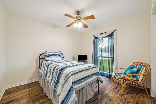 507 Williamsport St, League City, TX 77573 - bedroom featuring wood finished floors, baseboards, and a ceiling fan