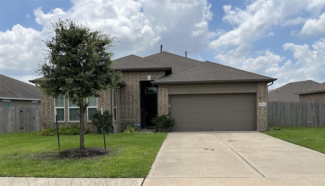 31909 Mckinley Run Dr, Hockley, TX 77447 - view of front facade with brick siding, a garage, concrete driveway, and roof with shingles