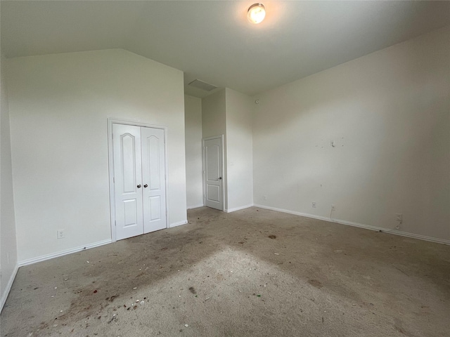 31909 Mckinley Run Dr, Hockley, TX 77447 - unfurnished bedroom with baseboards, lofted ceiling, and a closet