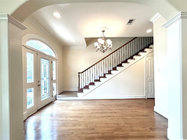 6021 Valley Forge Dr, Houston, TX 77057 - entryway with ornamental molding, a chandelier, stairway, wood finished floors, and recessed lighting