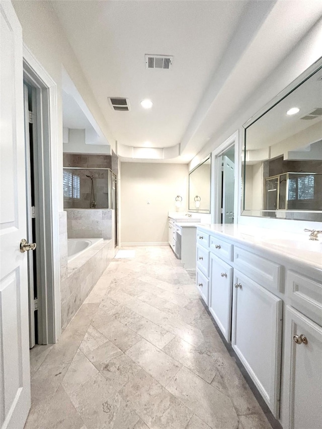 6021 Valley Forge Dr, Houston, TX 77057 - bathroom featuring a stall shower, two vanities, a garden tub, stone tile floors, and recessed lighting