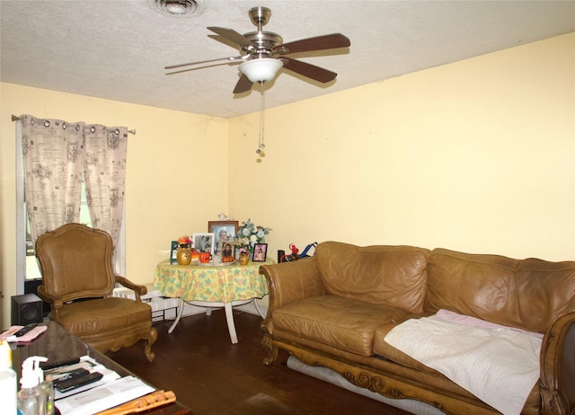 10406 Broadstairs St, Houston, TX 77013 - living room featuring wood finished floors, ceiling fan, and a textured ceiling