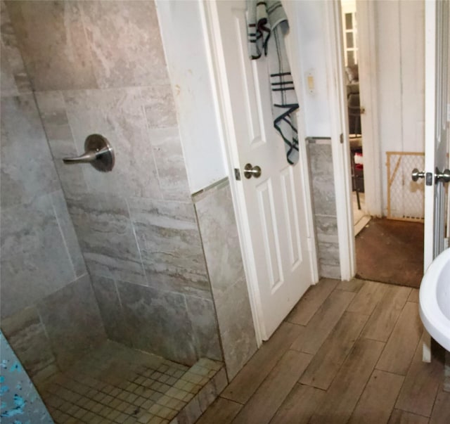 10406 Broadstairs St, Houston, TX 77013 - bathroom featuring wood finish floors and a tile shower